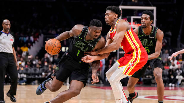 Mar 10, 2024; Atlanta, Georgia, USA; New Orleans Pelicans forward Zion Williamson (1) dribbles against Atlanta Hawks forward De'Andre Hunter (12) during the second half at State Farm Arena. Mandatory Credit: Dale Zanine-USA TODAY Sports